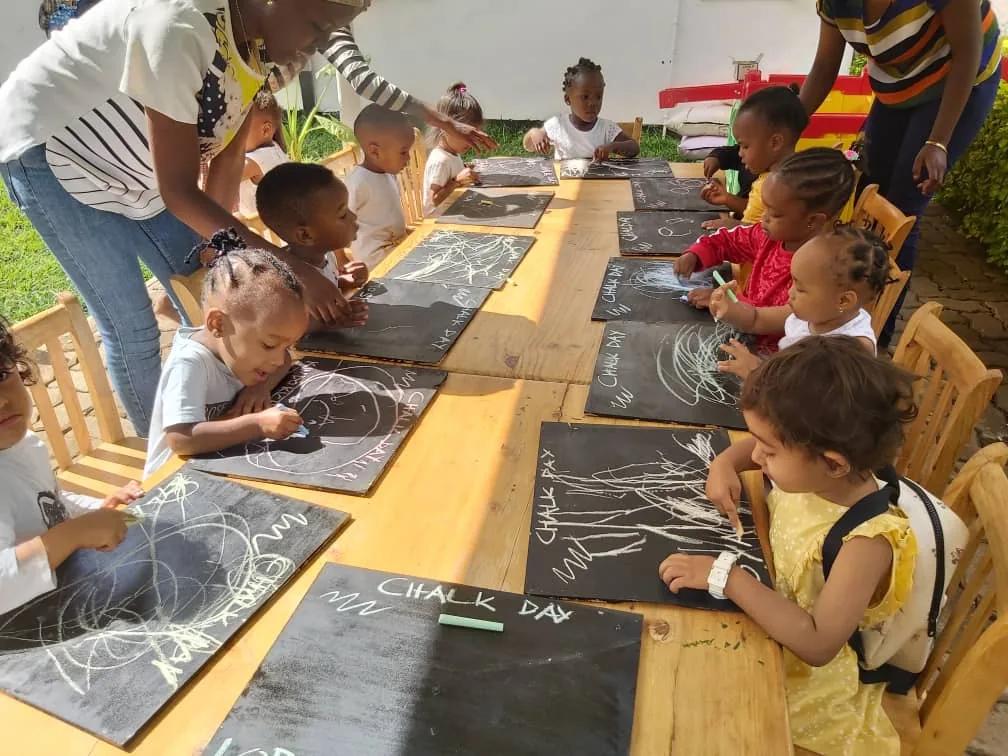 Children enjoying Chalk Day at The Little Nest preschool, Arusha
